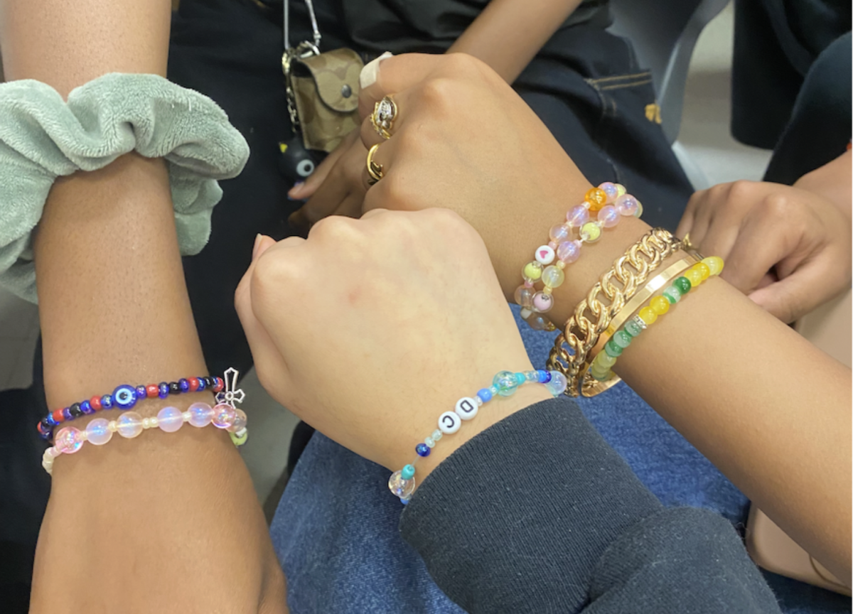 Members of the Beyond Beauty Club and the National Art Honor Society curate personalized bracelets with unique patterns. Students had the opportunity to choose beads from a wide selection to embrace their style. 