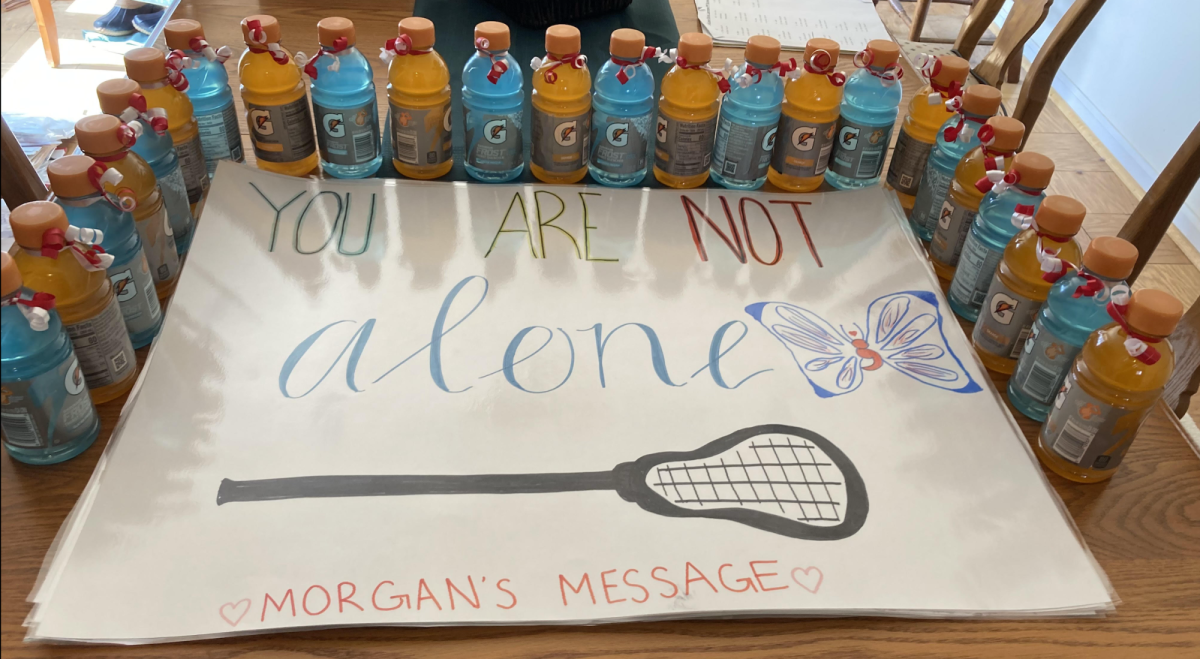 McLean's varsity girls lacrosse team created posters and organized gatorade in orange and blue for their dedication game. At the game, Morgan's story was shared and the team handed out wristbands. 
