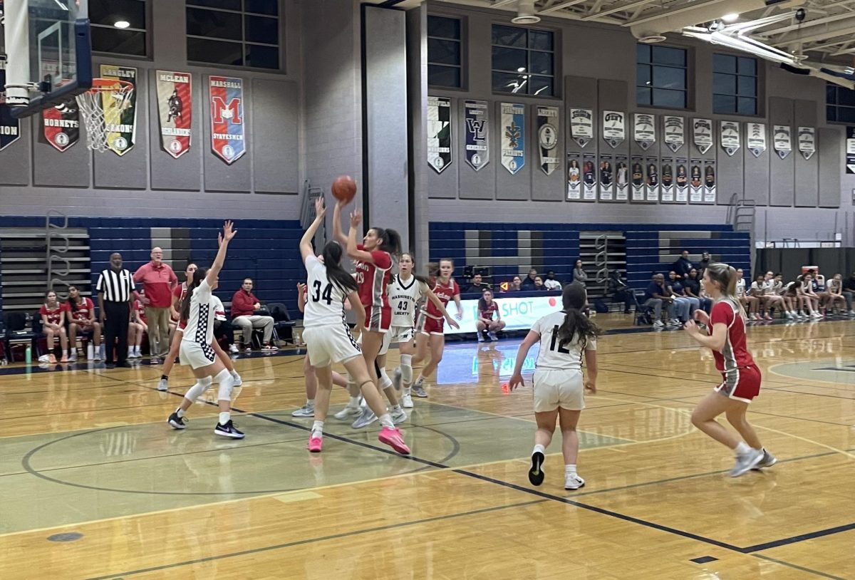 Junior center Karine Najarian puts up a shot in the paint. The Highlanders struggled against the W-L defense, mustering only 19 points. 