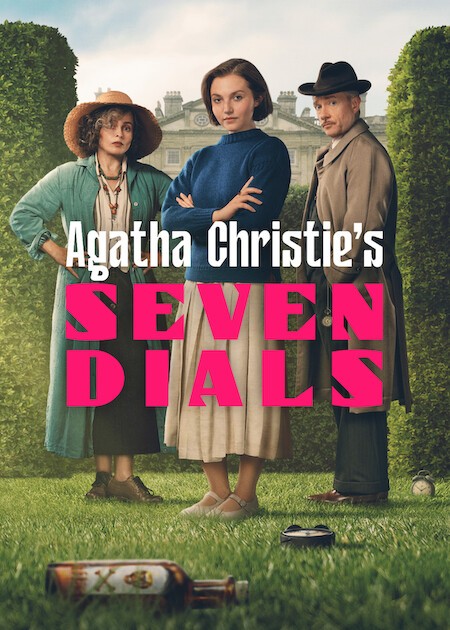 The cover of Agatha Christie's Seven Dials TV adaptation shows amateur sleuth Lady Eileen "Bundle" Brent (Mia McKenna-Bruce) in the center with her costars Superintendent Battle (Martin Freeman) and Lady Caterham (Helena Bonham Carter) posed to the sides. The stars are on the lawn of a country estate littered with a bottle and a couple clocks. 