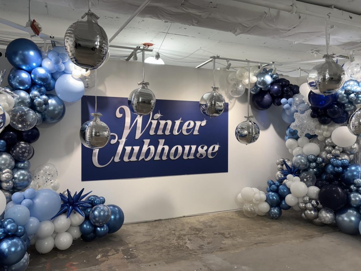 Balloons and decorations welcome customers into Winter Clubhouse. The blue color theme reflects the event's winter branding.