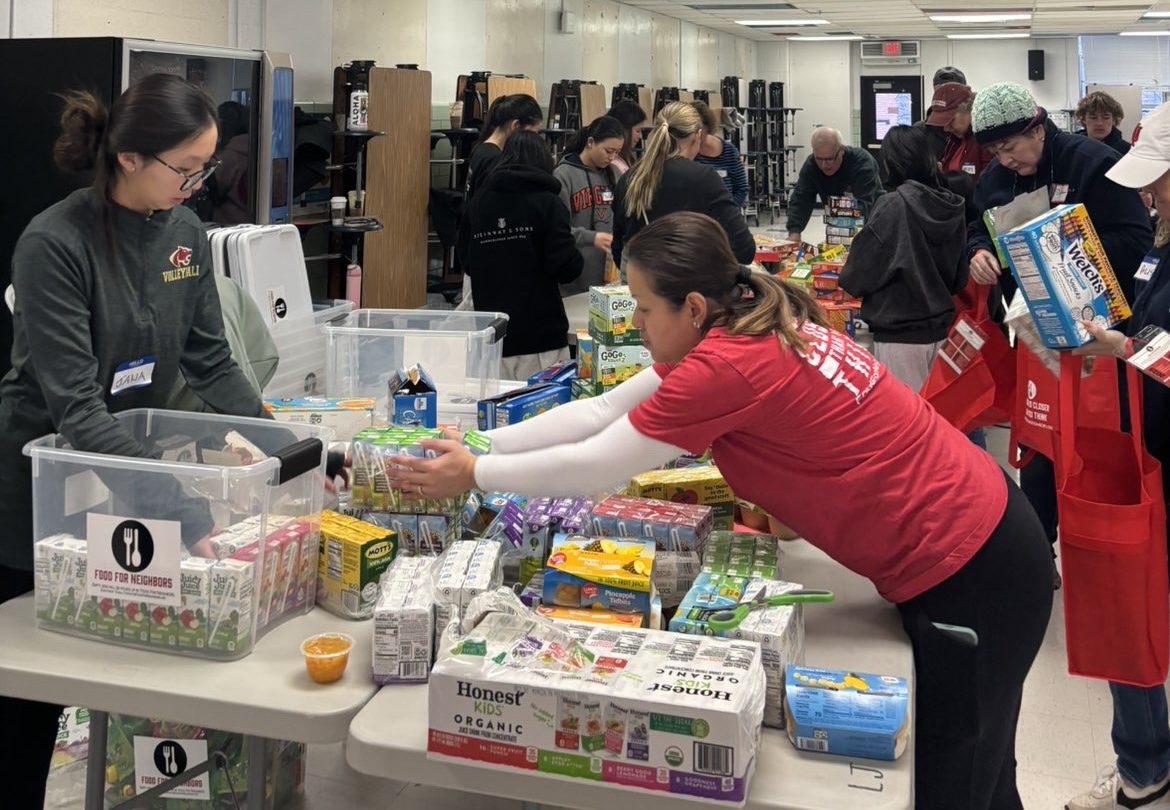Volunteers at Luther Jackson Middle School on Saturday, Jan. 17 help organize red bag donations with specific school chapters. McLean McPantry was a part of this process. 