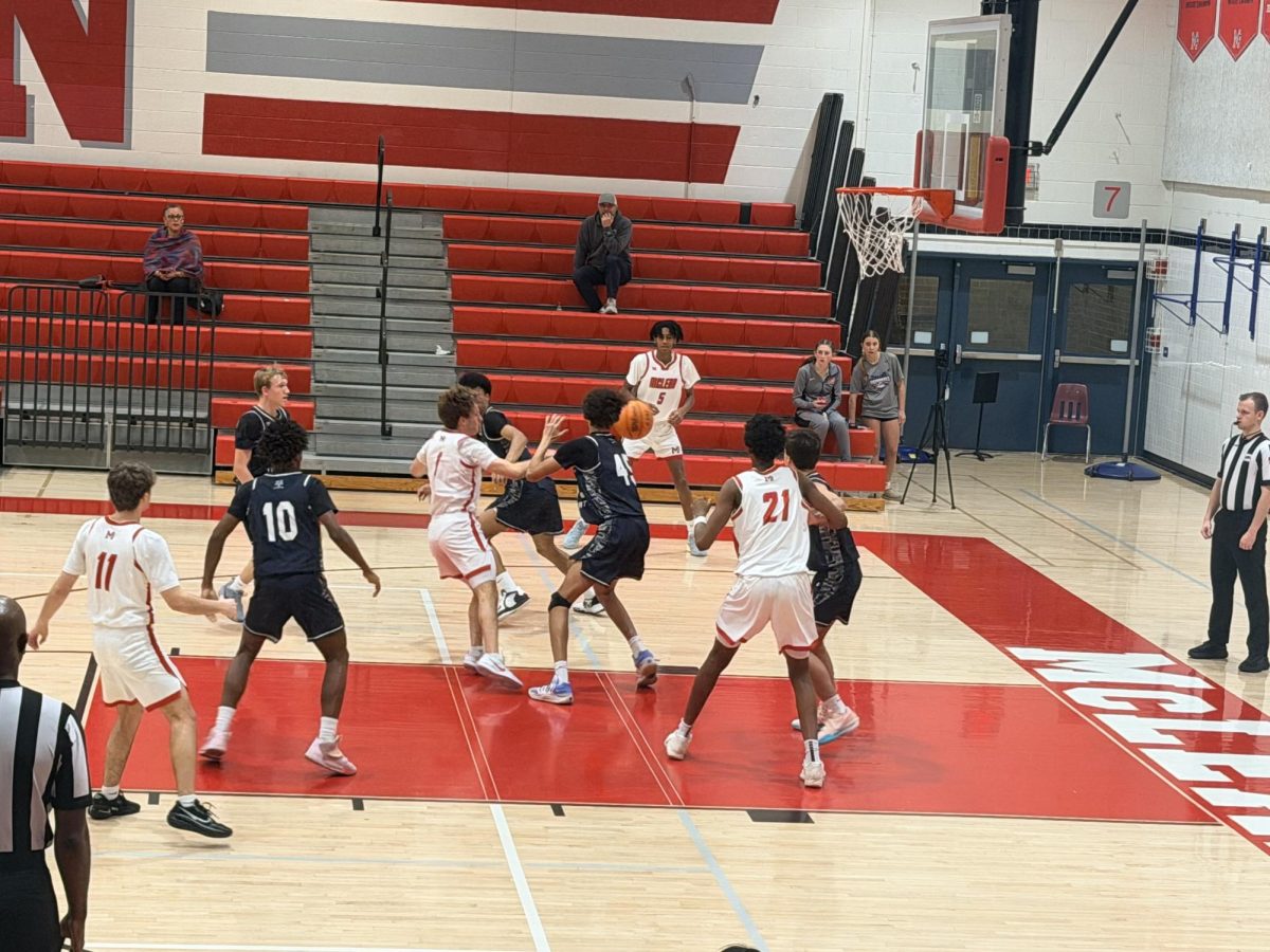 Senior Logan Baldrate hurls a pass to Sophomore Nahom Kidane deep in the second half. Kidane would go to sink the game-winning basket for the Highlanders at the buzzer.