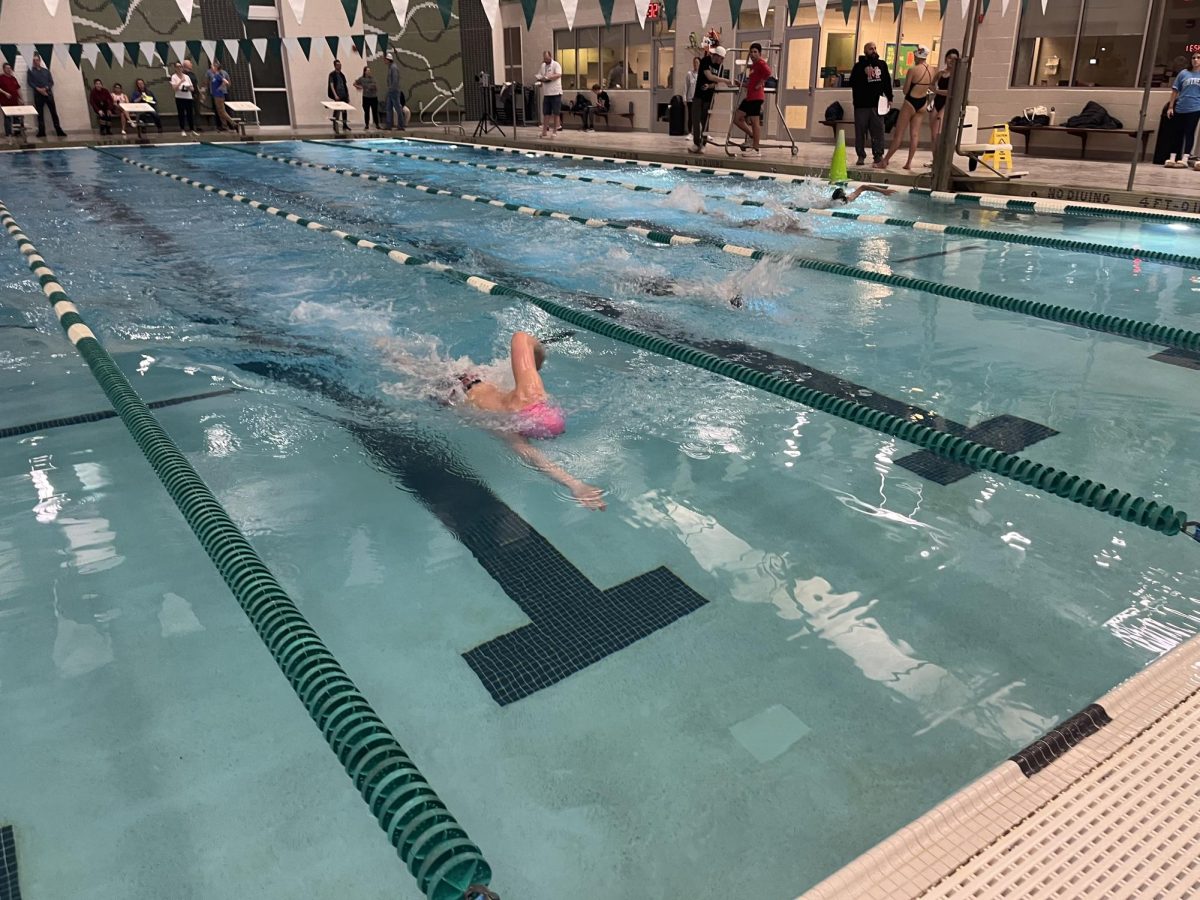 Junior Cameron Parkhomenko pushes ahead in the 500-yard freestyle. He scores first place in this event. 