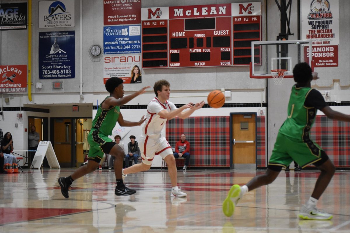Senior Guard Logan Baldrate passes it off to a teamate. Baldrate has been a key player for the Highlanders, starting every game this season.