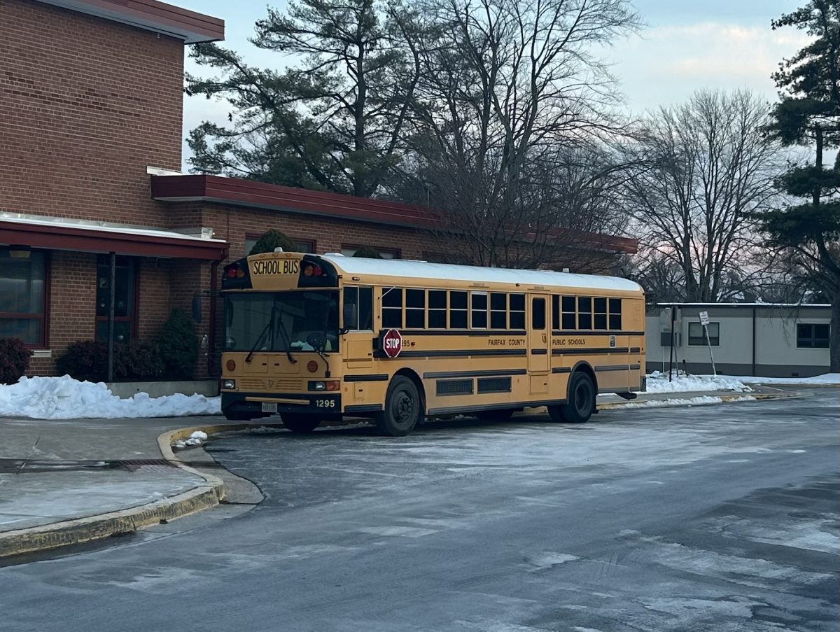 A school bus lingers along the curb of McLean High School immediately after school on Wednesday, Feb. 4. 