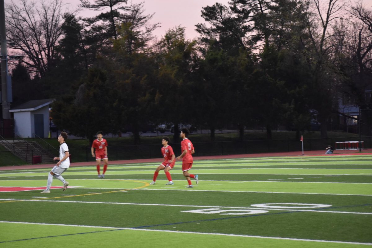 The Highlander back-line readies themselves for a header against Westfield. The defense struggled throughout the game, allowing two goals.