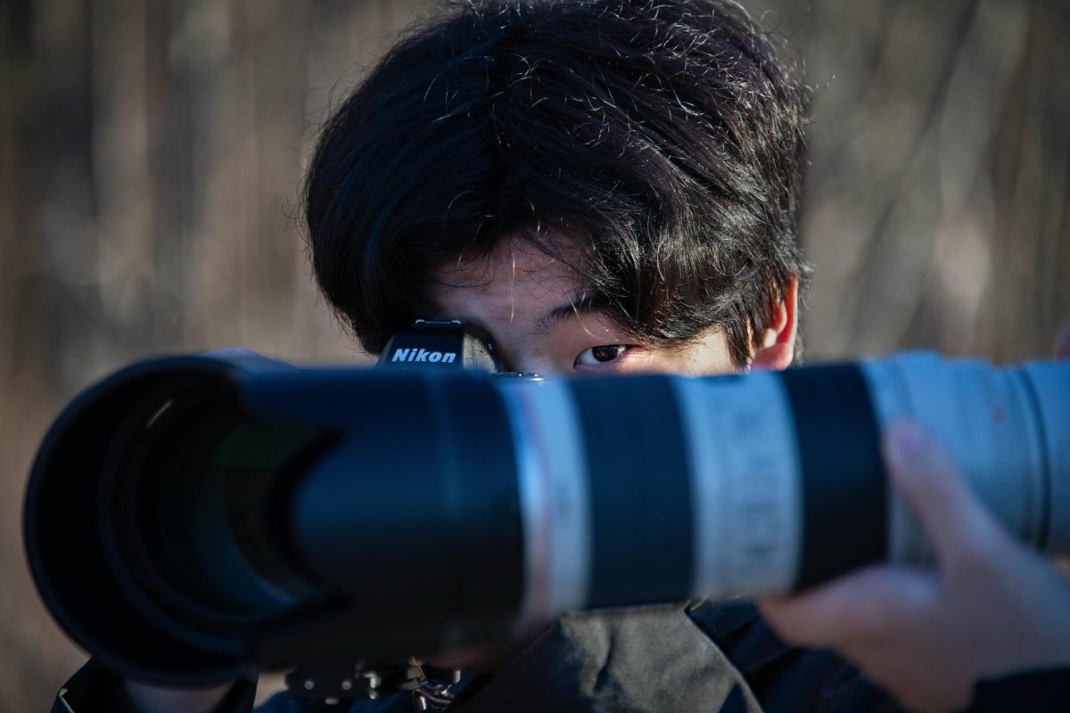 Senior Wonwoo Do sets up his Nikon camera for a perfect shot.