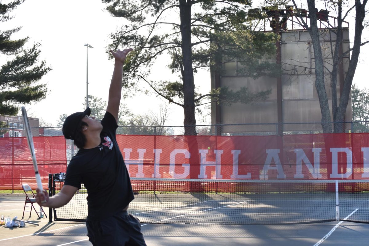 Senior Captain Colin Trinh serves to his opponent. Colin lost two hard fought battles against his Marshall oppenent.