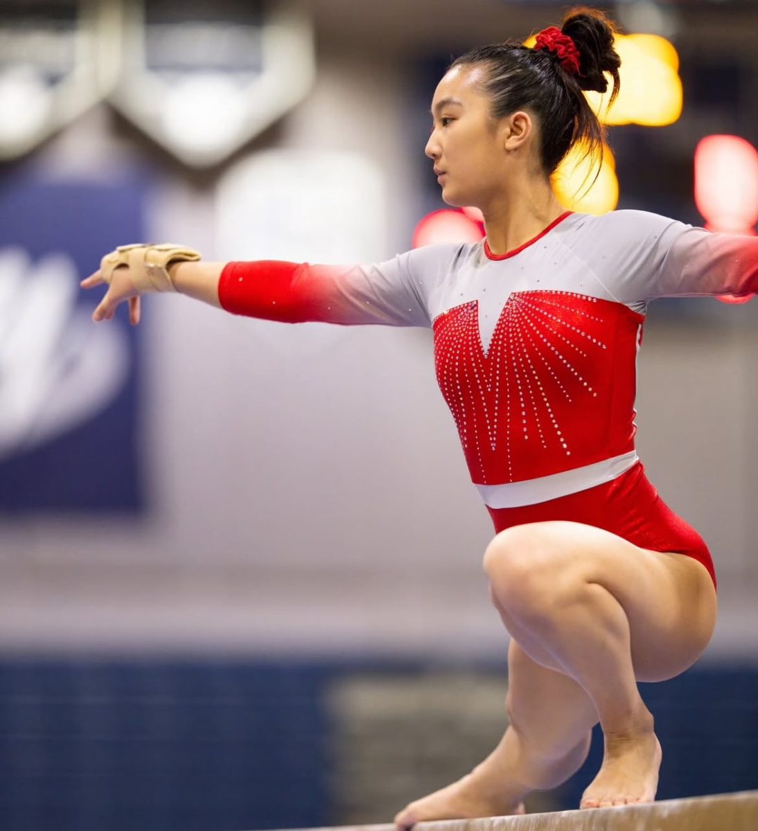 Gymnastics captain Olivia Nguyen does her beam routine. Her leadership helped the team achieve two victories this season.
