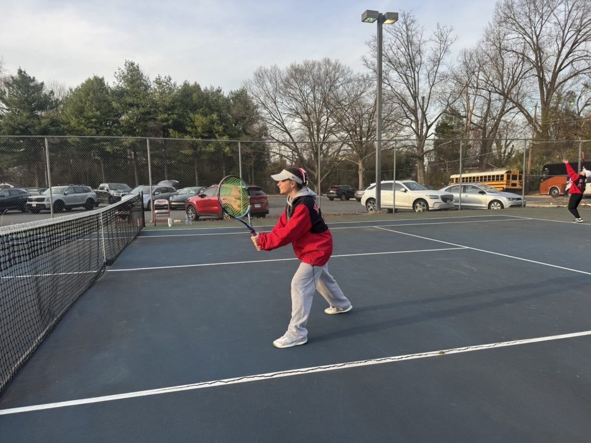 Senior Katelyn Gray looks poised at the net ready for any shot that comes her way. Gray accounted for many put away volleys and overheads in this match.
