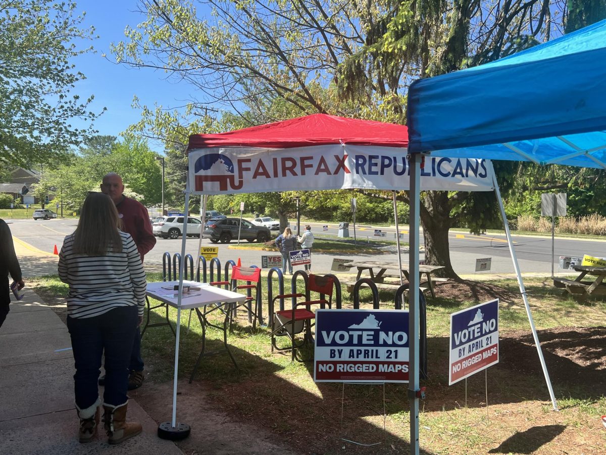 Representatives from both parties set up booths outside of local schools to help voters find a verdict regarding redistricting in Virginia