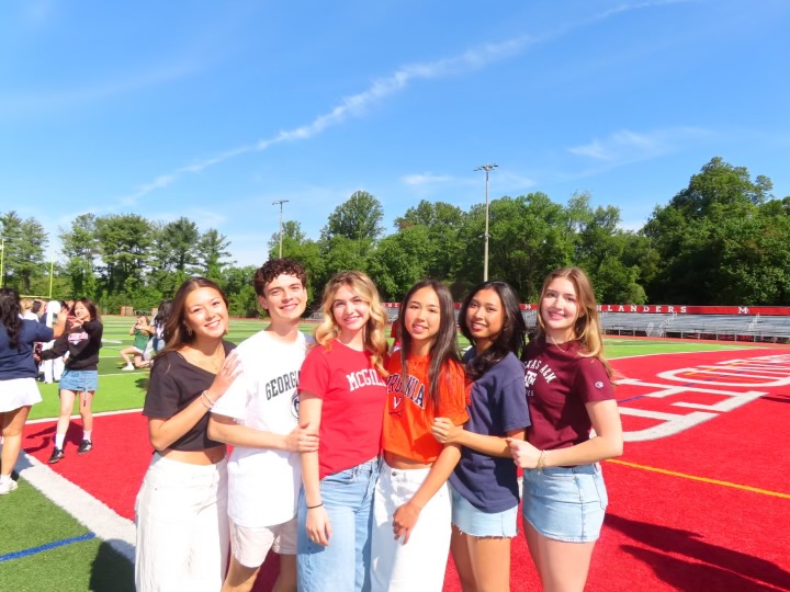 Seniors Julie Daniel, Thomas Chestnut, Kathryn Thomas, Keely Soloman, Jessica Lee and Caroline Johnson gather together to celebrate their commitments to four-year colleges.