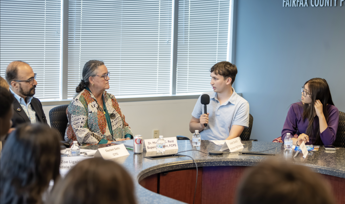 Student journalist Joseph Davitch from Woodson High School shares his question to Superintendent Michelle Reid and Chief Information Technology Officer Gautam Sethi. Journalists and FCPS staff actively engage in the conversation together. 
