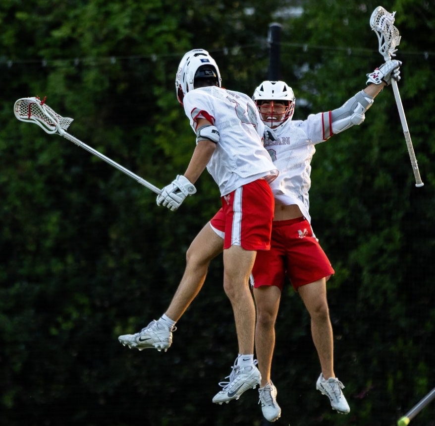 Seniors Nader El Farhan and Michael Babalitis celebrate a goal on their senior night. They both scored on their special night, leading to an 18-3 victory. 