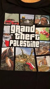 A student at TJHSST wore this shirt and was instructed to remove it due to a weapon appearing on the shirt. The student later realized there was no weapon, and felt that she was targeted due to the writing "Grand Theft Palestine."