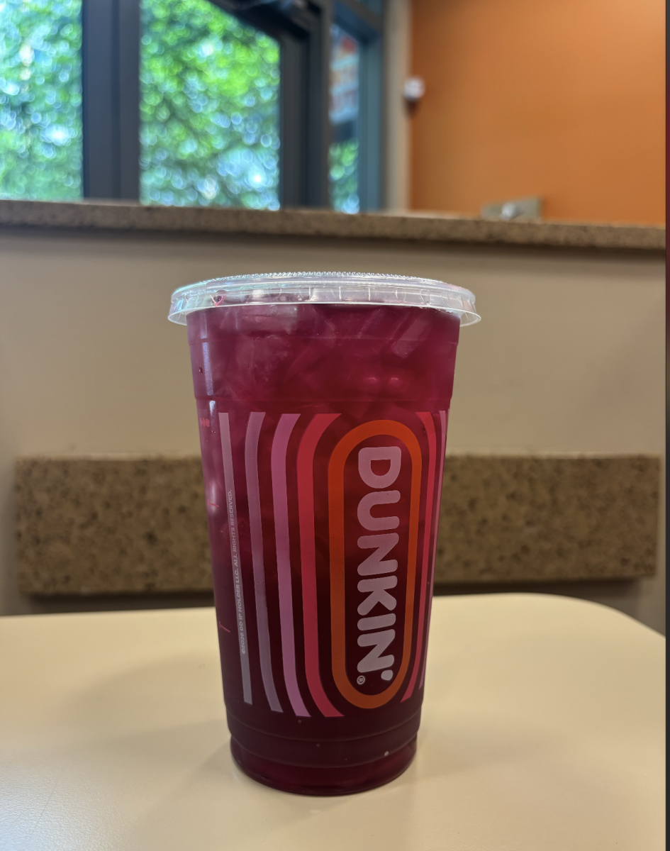 The new Cherry Lime Rickey Refresher is a vibrant, dark magenta color and looks like a typical water-based drink.