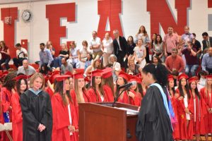Principal Raven Jones begins the ceremony with an opening speech, addressing seniors and parents.